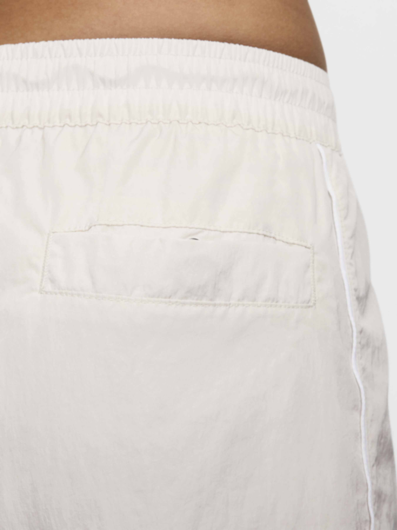 Брюки NIKE WINDRUNNER модель FV7655-110 Фото