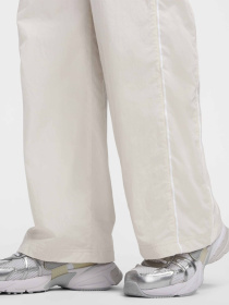 Брюки NIKE WINDRUNNER модель FV7655-110 Фото