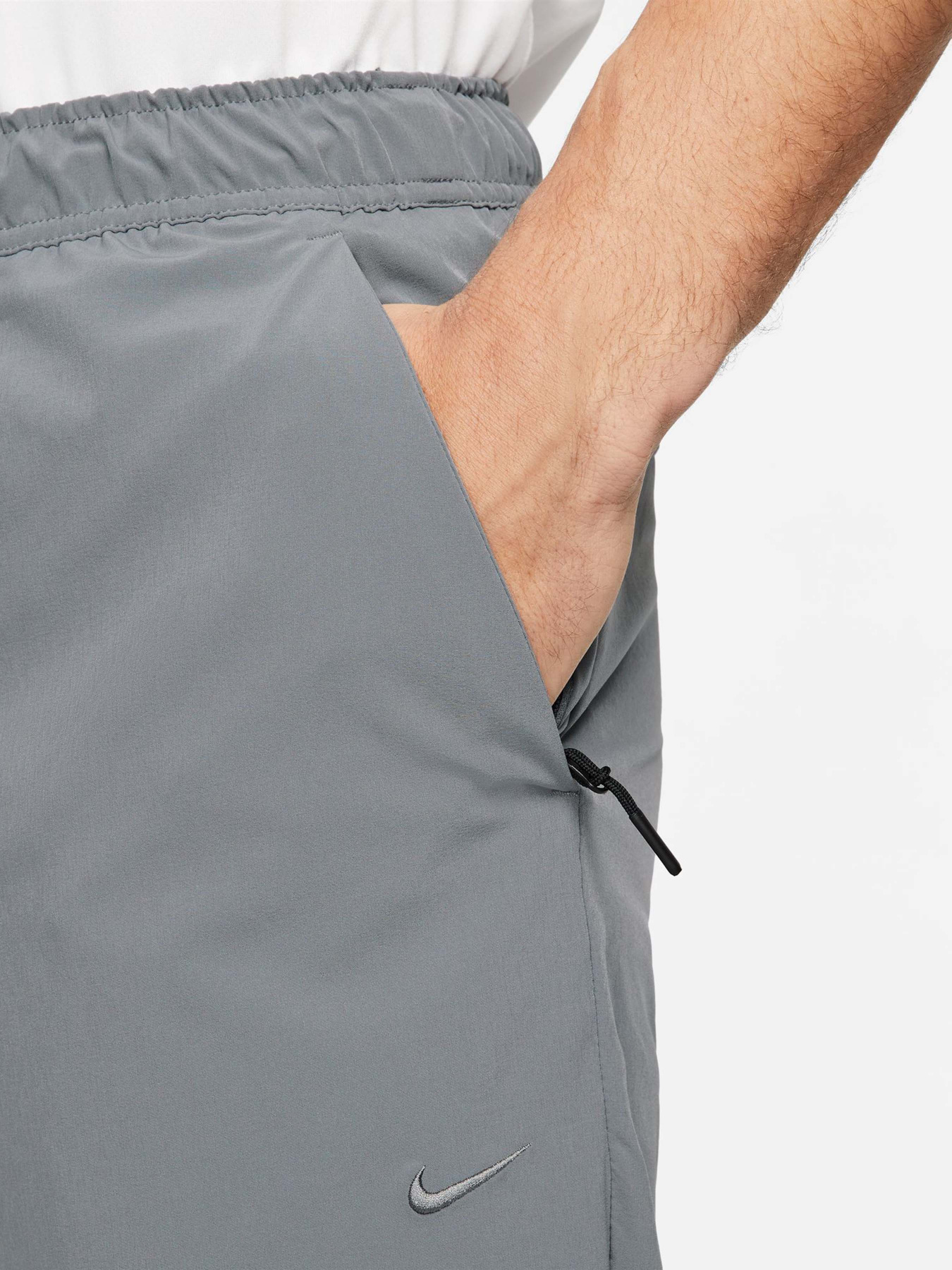 Штани NIKE DRI-FIT UNLIMITED TAPERED LEG модель FB7548-084 Фото