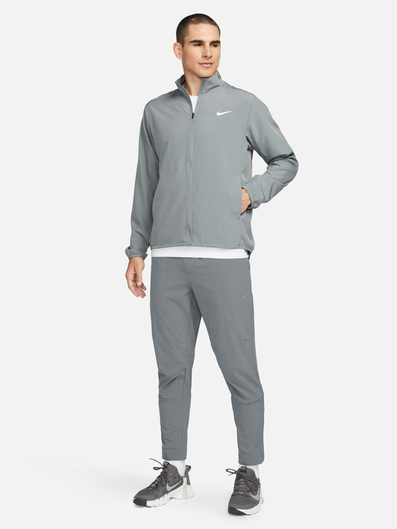 Штани NIKE DRI-FIT UNLIMITED TAPERED LEG модель FB7548-084 Фото