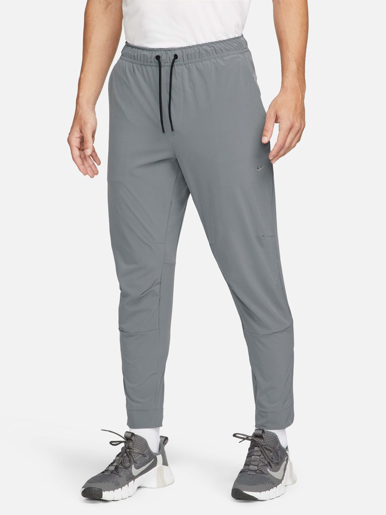 Штани NIKE DRI-FIT UNLIMITED TAPERED LEG модель FB7548-084 Фото