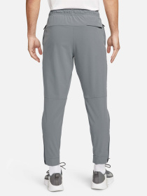 Штани NIKE DRI-FIT UNLIMITED TAPERED LEG модель FB7548-084 Фото