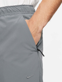 Штани NIKE DRI-FIT UNLIMITED TAPERED LEG модель FB7548-084 Фото