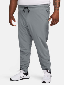 Штани NIKE DRI-FIT UNLIMITED TAPERED LEG модель FB7548-084 Фото