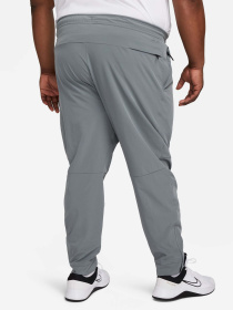 Штани NIKE DRI-FIT UNLIMITED TAPERED LEG модель FB7548-084 Фото