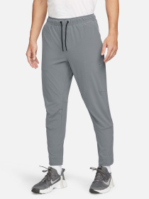 Штани NIKE DRI-FIT UNLIMITED TAPERED LEG модель FB7548-084 Фото