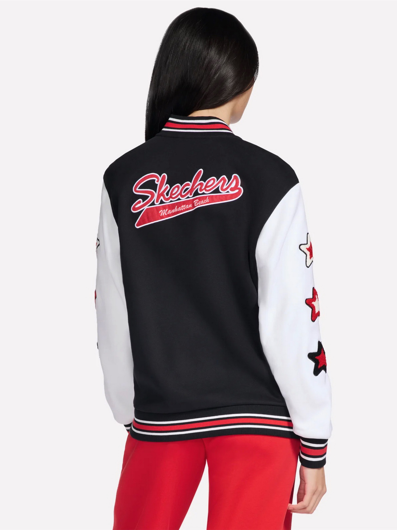 Куртки и дубленки Skechers SKECHERS CLASSIC VARSITY JACKE модель JA291 BLK Фото