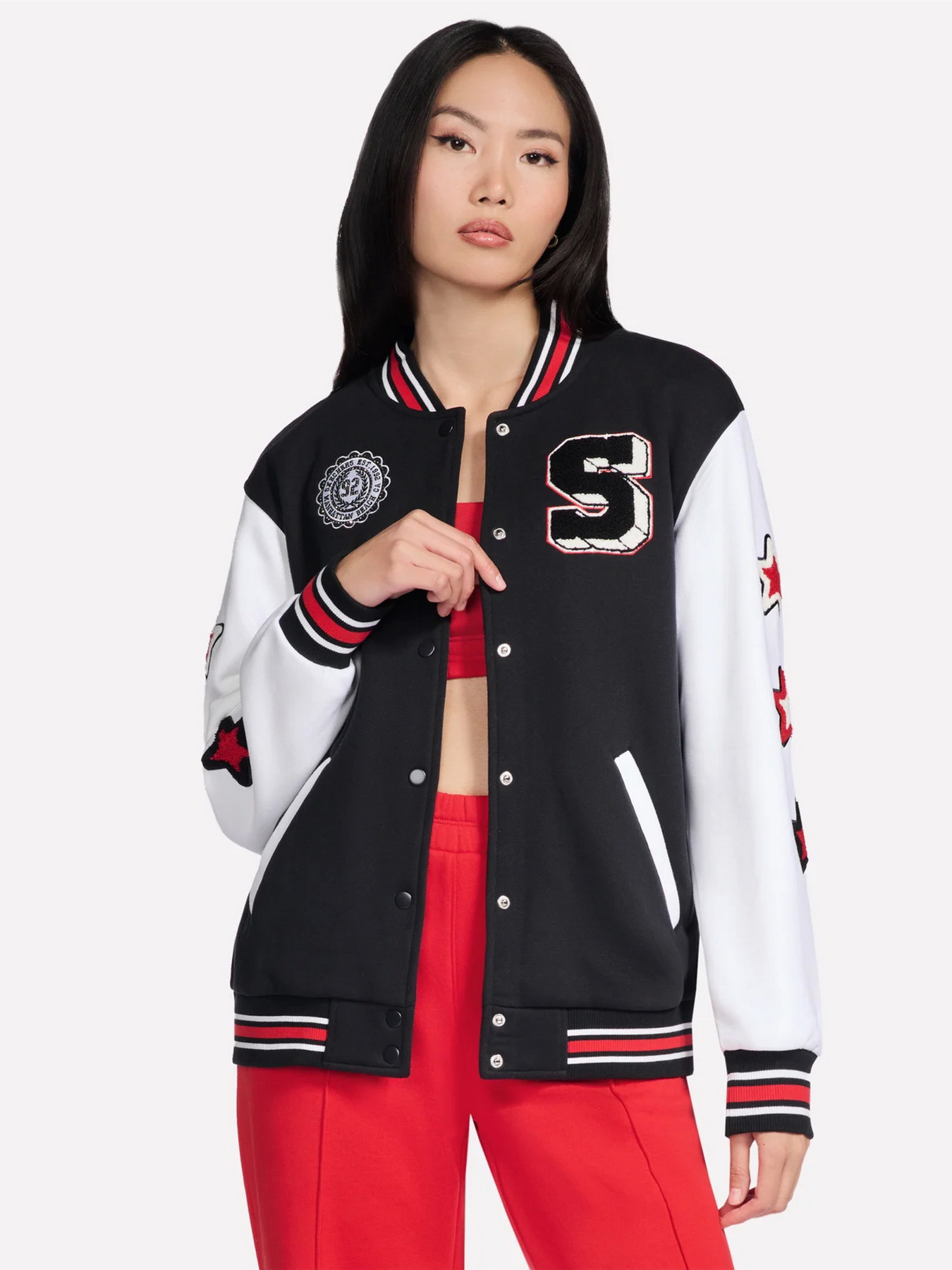 Куртки и дубленки Skechers SKECHERS CLASSIC VARSITY JACKE модель JA291 BLK Фото