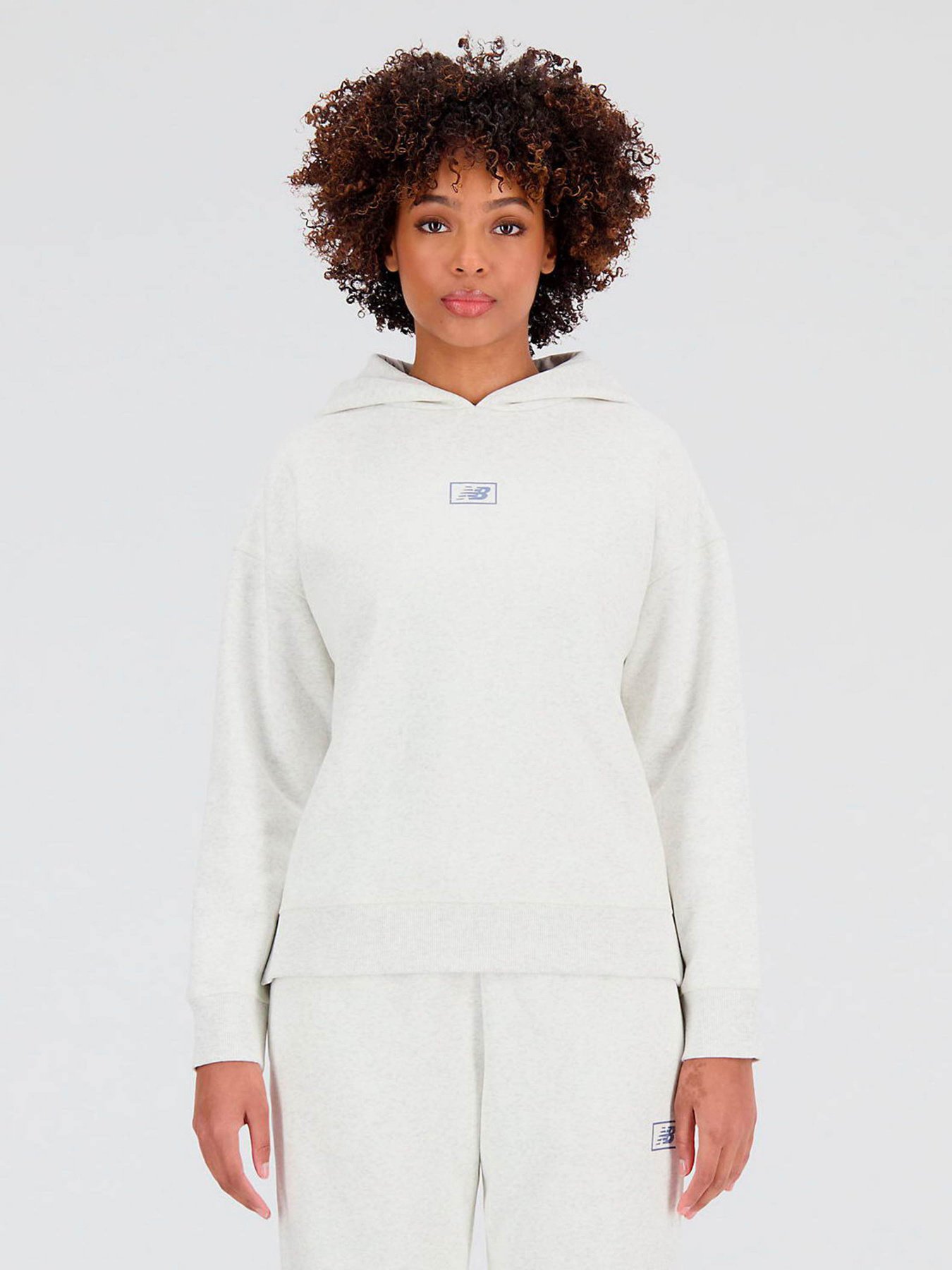 Худі та світшоти New Balance Essentials Brushed модель WT33503SAH Худі та світшоти New Balance Essentials Brushed модель WT33503SAH Фото