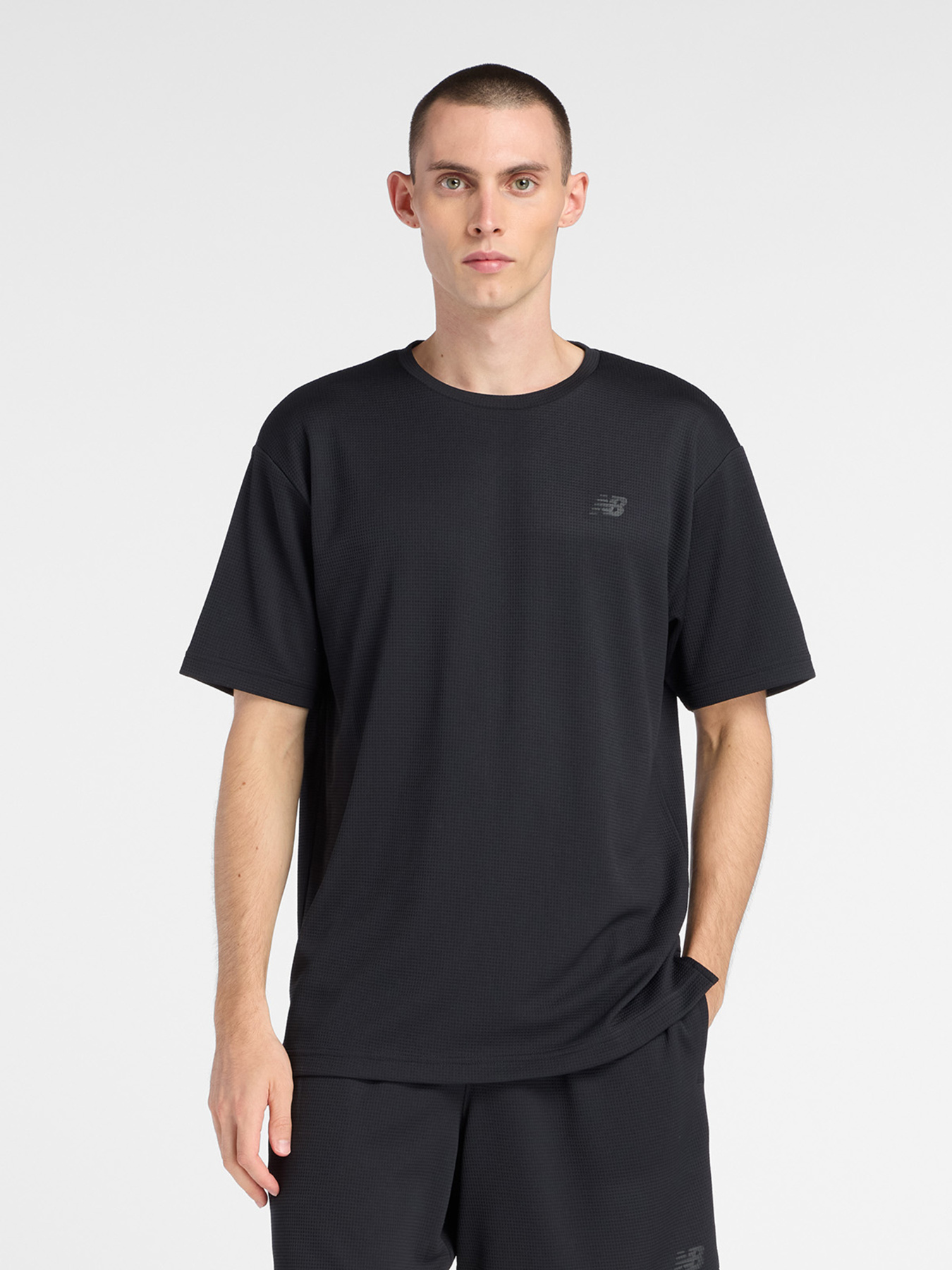 Футболки і поло New Balance TEXTURED CHECK модель MT6100FRBK Футболки і поло New Balance TEXTURED CHECK модель MT6100FRBK Фото