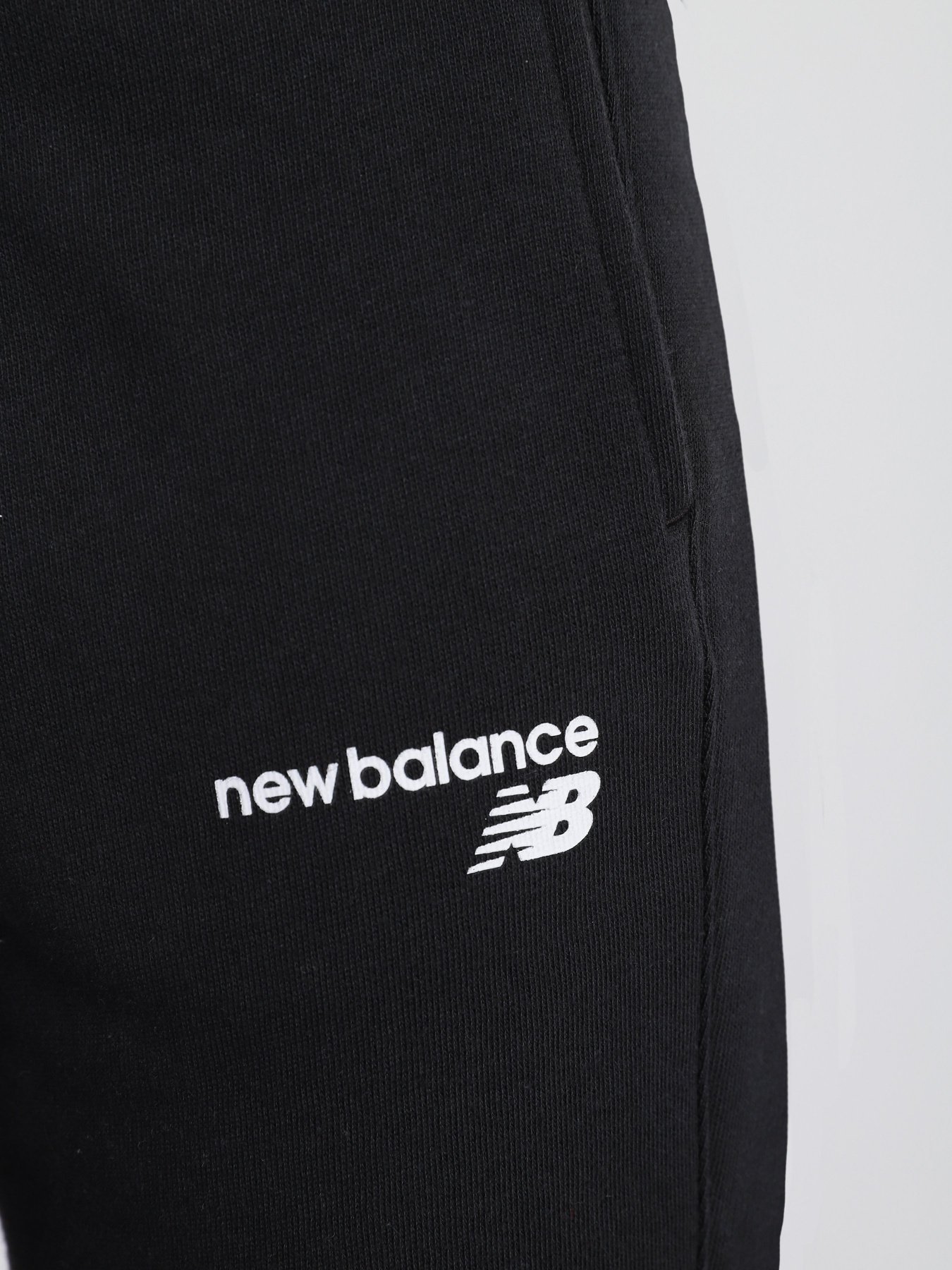 Штани New Balance CLASSIC CF модель WP03805BK Фото