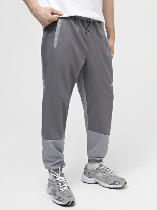 Штани The North Face M Ma Wind Track Pant модель NF0A87J6W2O1 Фото