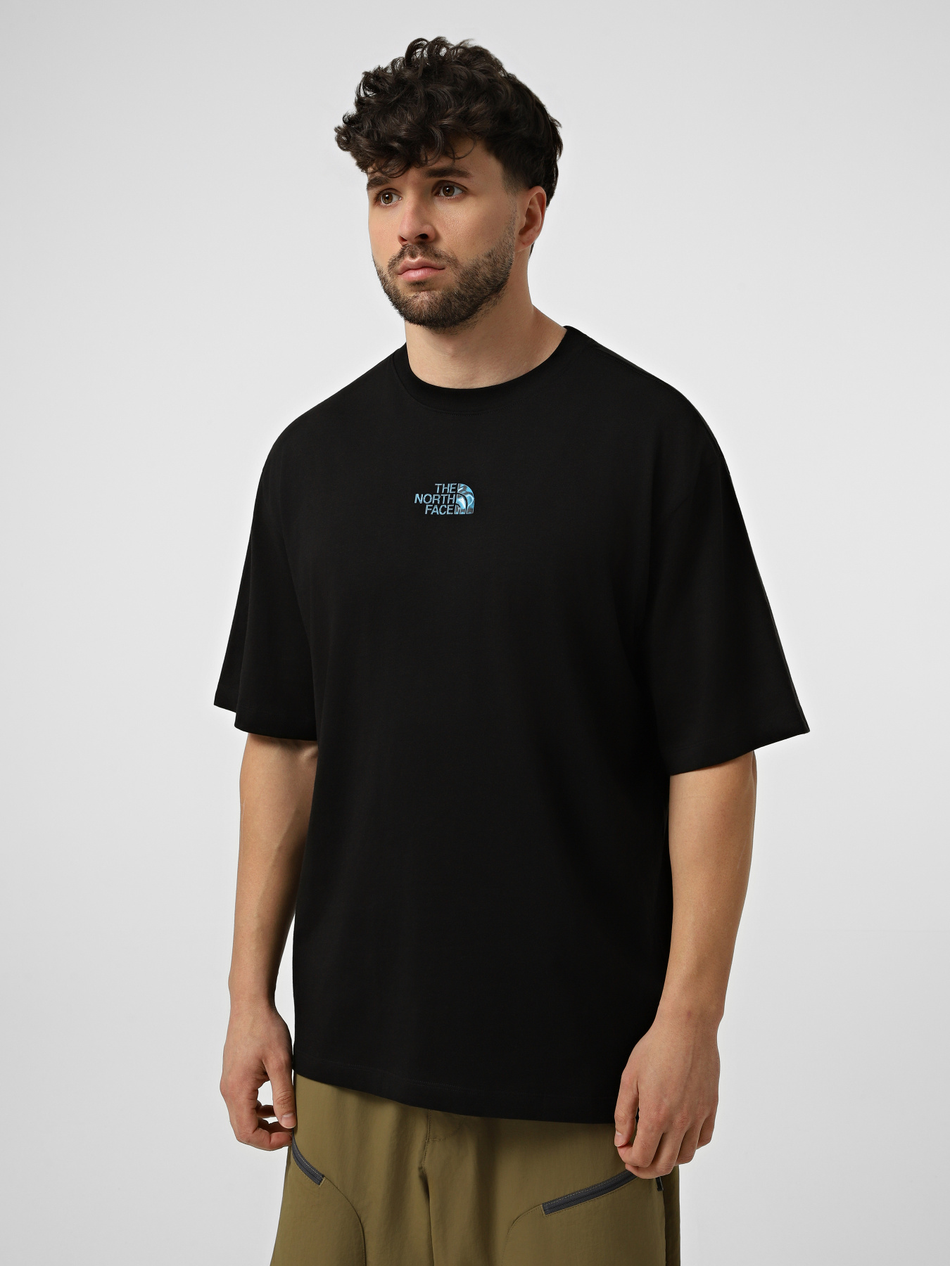 Футболки і поло The North Face M LIQUID LOGO OVERSIZE SHORT S модель NF0A8G9UJK31 Фото