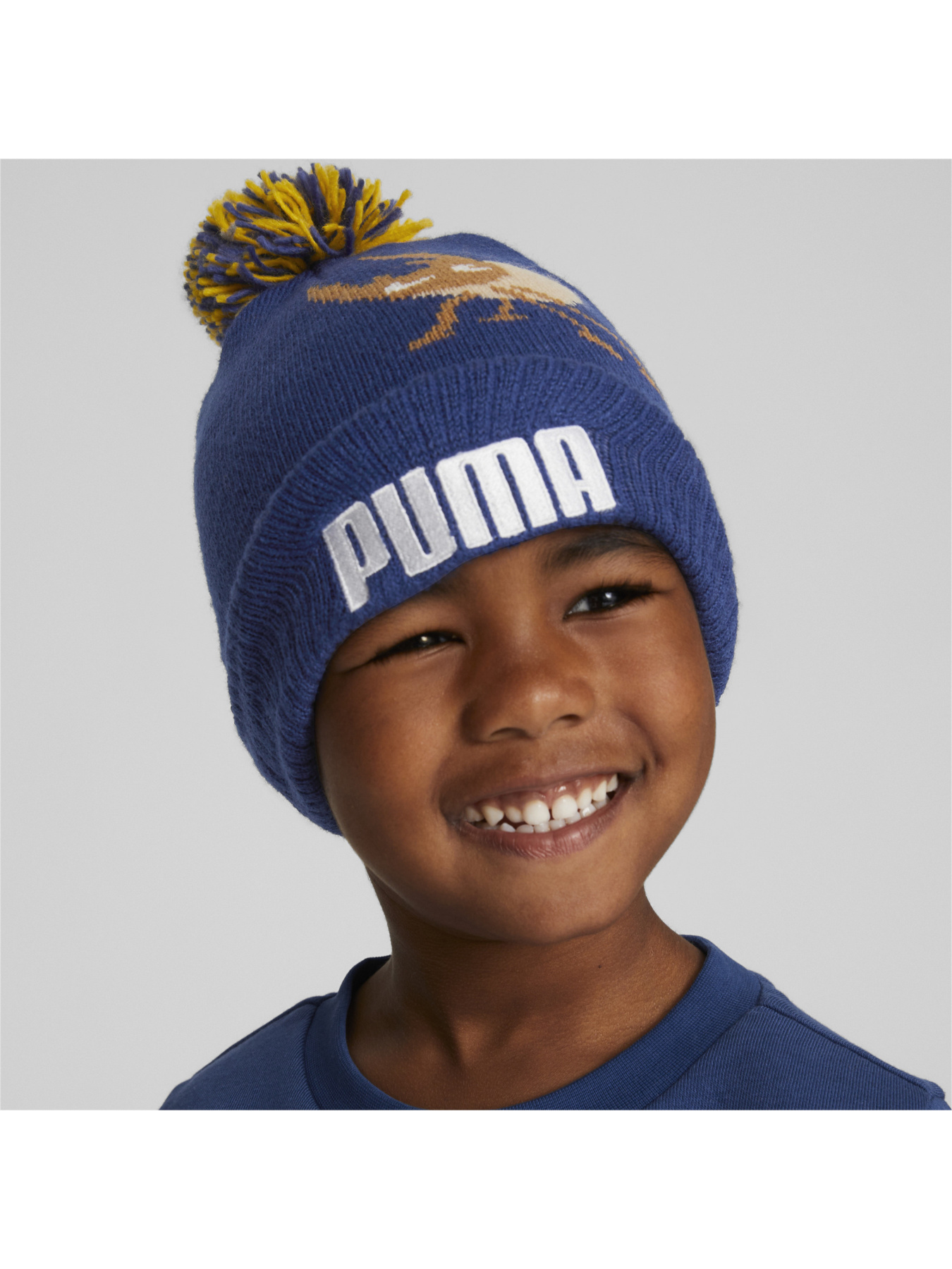Шапки та кепки PUMA Small World Pom Beanie модель 024073 Фото